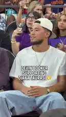 This short clip captures NBA star Devin Booker in the stands, watching his friend and WNBA legend Diana Taurasi play. Booker is seen smiling and reacting positively to the game, showcasing a moment of support between two prominent athletes. by @wnba with Original Sound by wnba