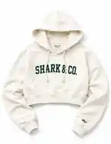 A slow-motion, high-detail showcase of Mark The Shark's latest apparel drop: the 'SHARK & CO.' cropped hoodie. This stylish off-white piece features bold collegiate-style lettering and a minimalist design, presented against a clean background. The visual highlights the garment's fit, fabric texture, and branding details, emphasizing its appeal for fans of streetwear, personal branding, and lifestyle fashion. by @mts550 with original sound