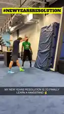In this short clip, Bob Reese shares his New Year's resolution to finally learn a handstand. He practices the skill with the help of a coach in a gym setting, demonstrating the initial steps and using a padded wall for support. by @bob_reese with Original Sound by bob_reese