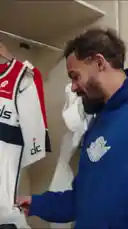 A Washington Wizards player shares a personal moment in his locker room, showcasing his team jersey and Air Jordan apparel. This intimate look into the athlete's life offers fans a unique glimpse into the world of professional basketball. by @washwizards with original sound