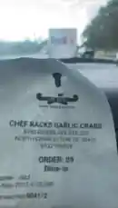 This close-up shot focuses on a receipt from Chef Racks Garlic Crabs, located in North Charleston, SC. The receipt details a dine-in order placed on September 18, 2025, providing information about the restaurant, location, and transaction specifics. by @marcus.randall with Original Sound by marcus.randall
