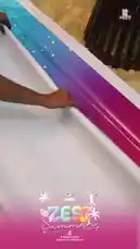 This video provides a behind-the-scenes look at the ZEST Summer Camp, organized by Al Maqar English Medium School Nadukani. It begins with the unboxing of promotional materials, including brochures and certificates, before showcasing the official camp poster. The poster details the event's theme 'Just Not Learning it,' its dates (May 11-12-13), and a list of activities such as student-led games, science discovery, public speaking practice, and more. The energetic electronic music track complements the vibrant and exciting atmosphere of the summer camp. by @engbuzzindia24 with Original Sound by engbuzzindia24