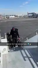 Watch as a player associated with the LA Clippers descends the aircraft stairs at the airport, showcasing a casual yet stylish look with a black tracksuit and cap. This candid moment captures the behind-the-scenes travel vibe of a professional athlete, providing fans with an authentic glimpse into life off the court. by @clippers with Original Sound by clippers