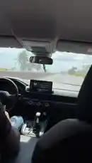 A first-person perspective from inside a car, showing a driver navigating city streets. The view includes the dashboard, steering wheel, and the road ahead, capturing the experience of a daily commute or a casual drive. by @delwinbazilme with Original Sound by delwinbazilme
