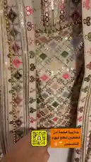 Watch this stunning traditional Indian bridal outfit being unveiled. The video showcases a beautifully crafted lehenga choli set with intricate mirror work, sequins, and floral embroidery on a cream base. A matching sheer dupatta with delicate patterns completes the ensemble. This elegant piece is presented on a mannequin, highlighting its design and craftsmanship. by @needle_t with موسيقى تركية جميلة by pianist Band