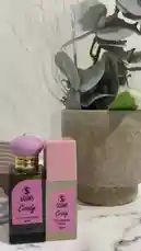 A stylish product showcase featuring SOINS Candy Eau de Parfum and SOINS Candy Pheromone Touch. This elegant presentation highlights the perfumes' packaging and branding, suggesting a review or demonstration of their features. by @soins_sa with Original Sound by soins_sa