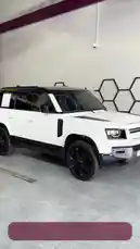 This video provides a professional walkthrough of a pristine white Land Rover Defender inside REFLECTION Car Care's facility. The camera pans around the vehicle, highlighting its glossy finish, black accents, and custom wheels, all presented under clean, modern showroom lighting. The focus is on the car's immaculate condition, suggesting a premium detailing service. by @reflection.car with Original Sound by reflection.car
