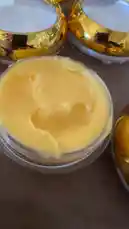 Watch this close-up review of Semsema Herbal Beauty's night cream. A gloved hand points out the luxurious texture of the yellow cream in a clear jar, while the speaker explains its key benefits. This vitamin C-rich formula is designed for nighttime use to target dark spots, reduce pigmentation, and provide intense hydration, acting as a complement to a daytime skincare routine. by @semsemallc25 with Original Sound by semsemallc25