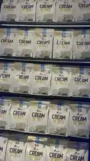 This close-up shot shows multiple packages of LA Nutrition Cream of Rice cereal neatly arranged on a store shelf. The product is highlighted as a convenient instant rice cereal option, ideal for breakfast or snacks. by @lanutritioniraq with original sound