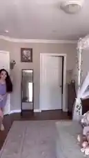 In this fashion-focused video, Ruby Jay unboxes a new green dress from a package, models it in her bedroom, and shares her styling process. She showcases the dress's details, including its floral pattern and ruched bodice, before posing with a pet rabbit. The video captures the excitement of a new clothing haul and provides a full look at the outfit. by @iamrubyjay with original sound