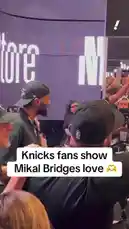 In a heartwarming display of team spirit, New York Knicks fans passionately show their support for star player Mikal Bridges during a public event. The crowd erupts in cheers, chanting his name and capturing the moment on their phones as he makes his way through the excited fans. by @yahoosports with Original Sound by yahoosports