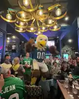 Get ready for some serious Philadelphia Eagles spirit! This energetic fan gathering in London is packed with fans in green jerseys, the beloved mascot, and even special appearances from Brian Westbrook and Jay Ajayi. The crowd is electric, cheering on their team during a live game broadcast, creating an unforgettable atmosphere for Eagles supporters abroad. by @eagles with Original Sound by eagles