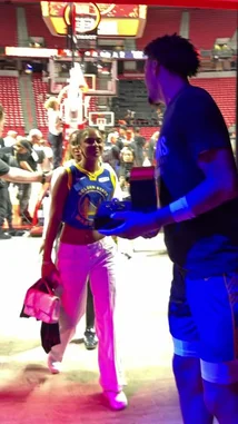 This video captures Golden State Warriors star Stephen Curry celebrating his team's championship victory with his family in a vibrant Las Vegas nightclub. Dressed in a 'Champions' t-shirt, Curry shares a joyful moment with a young fan holding a trophy replica, showcasing the personal side of sports success. by @nba with Original Sound by nba