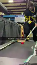 In this surprising indoor sports moment, a player named Emiliano, dressed in a Pittsburgh Penguins jersey, is caught mid-game during an air hockey challenge. As he attempts a shot, another person suddenly jumps onto the table, causing him to lose his balance and fall backward into the trampoline area behind him. The unexpected guest, wearing a 'POLICE' shirt, then playfully interacts with Emiliano before jumping off the table themselves. The entire sequence unfolds in a recreational facility with visible 'TRAMPOLINE AREA RULES,' capturing a spontaneous and hilarious clash between competitive gaming and playful chaos. by @amiliflips with Original Sound by amiliflips