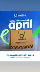 A static promotional image for Launderra, a new laundry service. The ad features a brown paper bag with the company's logo and contact information against a blue background with 'Happy New Month April' text. The creator is EKO〽️. by @launderra with Happy Mood🎉🤭 by Gigi❤️‍🩹