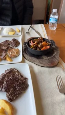 This short clip from N7📸 offers a delicious look at a fine dining experience. It starts with a close-up of a beautifully plated steak dinner, then transitions to a breathtaking panoramic view of a city skyline across a wide body of water on a sunny day. by @n.c7x with Original Sound by n.c7x