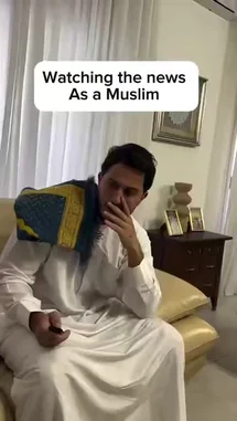 A man in traditional attire shares his reaction to news about a shooter. He expresses relief upon hearing the suspect is not Muslim, but then reacts with disbelief and frustration as the report reveals the individual converted to Islam and adopted a series of names. by @itz.miirah with Original Sound by itz.miirah