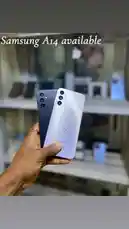 In this quick hands-on look, discover the Samsung Galaxy A14 smartphone in silver and black. See its sleek design, triple camera setup, and real-world presentation in a retail setting. Perfect for shoppers comparing new models. by @ab_god18 with original sound