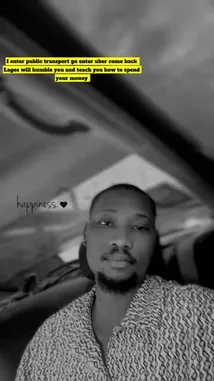 This is a static, black-and-white selfie of a man, identified as Semi, sitting inside a car. He looks directly at the camera with a calm expression. The word 'happiness.' accompanied by a heart emoji is overlaid on the image. The visual style is minimalist and introspective, capturing a simple moment of contentment. by @ralphsemi with highgrade💕 by noble