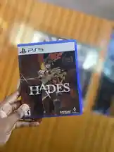 In this scene-by-scene breakdown, Frekas Global holds up the physical PS5 edition of Hades, showcasing its cover art and design. The video provides a clear look at the game case, ideal for collectors or those considering a purchase. by @frekasglobal with original sound