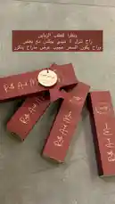 Watch as رطب اند مور reveals their premium gift packaging in this close-up showcase. The video highlights the elegant red boxes, gold script branding, and a special 'Rach' offer for customers. Perfect for anyone interested in luxury packaging design, unboxing experiences, or discovering new beauty brands. by @om.louraa with original sound
