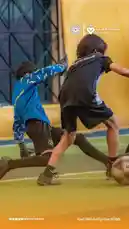 Watch the intensity unfold as a young player in black battles a goalkeeper in blue for control of the ball during a competitive youth soccer match. This dynamic scene captures the athleticism and determination of young athletes training under the guidance of جمعية اللاعب. by @playerassoc with original sound