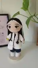 Watch this charming crochet doll dressed as a doctor, showcasing intricate details like a white lab coat, stethoscope, and blue pants. Perfect for handmade gift inspiration or amigurumi enthusiasts. by @r200an with original sound