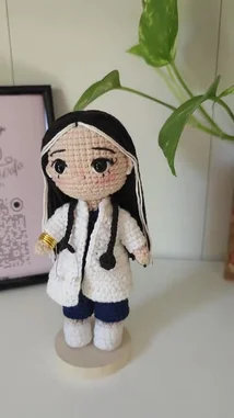 Watch this charming crochet doll dressed as a doctor, showcasing intricate details like a white lab coat, stethoscope, and blue pants. Perfect for handmade gift inspiration or amigurumi enthusiasts. by @r200an with original sound
