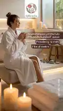 A serene woman in a white robe enjoys a warm beverage amidst candles and soft lighting, introducing the 'Powdery scents' and 'Floral notes' fragrance families. This tranquil moment, branded by QRcode, invites viewers to explore their personal scent preferences. by @qacodee with original sound