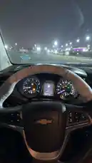 A first-person view from the driver's seat of a Chevrolet vehicle parked at night. The illuminated dashboard displays the speedometer, tachometer, and a central screen showing '286847 km'. The steering wheel has a protective cover, and through the windshield, city lights and a distant building with purple illumination are visible. by @mo_kbs8 with 😎🥇🇰🇷 by NFNF502 🌪💀