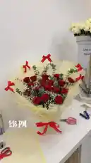 Watch a professional florist demonstrate how to elegantly wrap a luxurious bouquet of red roses with white filler flowers and eucalyptus. This detailed, real-time tutorial shows every step—from arranging the blooms to adding decorative red ribbons and yellow tissue paper. Learn essential techniques for creating a beautiful, gift-ready arrangement perfect for Valentine's Day, anniversaries, or any special occasion. Ideal for aspiring florists and DIY enthusiasts. by @dsunmusic with original sound