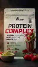 This dynamic product showcase from LA Nutrition features their new Strawberry Matcha Protein Complex. The video opens with a vibrant, close-up shot of a protein shake being poured, highlighting fresh strawberries and green powder. It then reveals the full product packaging, detailing its 'Advanced Protein Formula' with casein, egg, and whey proteins. The energetic music and quick cuts create an exciting atmosphere, perfect for enticing viewers interested in fitness nutrition. by @lanutritioniraq with Original Sound by lanutritioniraq