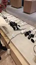 This video provides a close-up walkthrough of various modern lighting fixtures displayed on a long counter within a retail environment. A person's hand picks up and examines different models, showcasing their design and build quality. The setting appears to be a contemporary showroom or store, possibly for home improvement or architectural lighting, highlighting products from the ALEMAR CONCEPT brand. by @alemarconcept with alemarconcept by Original Sound