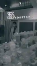 In this engaging clip, a barista from 365 Roastery stands behind the counter, using Arabic text overlays to explain various coffee brewing methods. He gestures towards different pieces of equipment, including an espresso machine and a pour-over setup, providing a clear, visual guide to techniques like drip, French press, espresso, and cold brew. by @roastery365 with Original Sound by roastery365