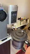 This concise video demonstrates the initial setup process for a Ninja coffee maker. It shows the user placing a carafe onto the machine and pressing a button on the control panel, accompanied by the sound of a coffee pod being dispensed into the brew basket. This simple walkthrough is ideal for anyone looking to get started with their new coffee appliance. by @alysf90 with Original Sound by alysf90