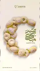 This elegant and celebratory image from Chef Fix features a beautifully arranged crescent made of traditional Eid cookies, dusted with powdered sugar and garnished with pistachios. The Arabic calligraphy 'Eid Mubarak' and the English text 'Happy Eid' are prominently displayed, creating a warm and inviting greeting for the holiday. The clean design and festive theme make it an ideal visual for sharing Eid wishes. by @chef_fix with Original Sound by chef_fix
