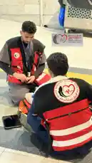 Witness real-time emergency preparedness in action as members of the Peace Message Volunteer Team demonstrate essential first aid techniques. This practical session highlights their commitment to community safety, showcasing training procedures and medical readiness during a public event. by @peace.message with original sound