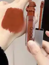 Watch this detailed swatch of OCCO's liquid lipstick in a warm terracotta shade. See the true color payoff and texture on skin. Perfect for anyone searching for long-lasting liquid lipsticks. by @butik.mariya with original sound