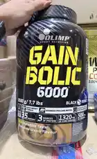 A close-up look at the Olimp Sport Nutrition Gain Bolic 6000 Black mass gainer tub, highlighting its key features like 35 servings, 1320mg pure creatine, and 'incredible taste' chocolate flavor. This product-focused shot is ideal for anyone researching top-tier supplements for muscle gain. by @lanutritioniraq with original sound