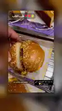 A mouth-watering display of food from CASPRS Restaurant. The video showcases a variety of items including burgers with sesame seed buns, golden french fries, and other side dishes served on metal trays. Close-up shots highlight the juicy burger patties and fresh ingredients, enticing viewers with a tempting feast. by @casprs.ksa with Original Sound by casprs.ksa