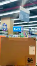This scene-by-scene visual summary captures a moment inside a brightly lit supermarket where a large cardboard box labeled 'UN3481' sits on a shelf. A digital price tag overlay shows '1499', hinting at a product being sold or restocked. The environment suggests a retail setting focused on consumer goods, possibly electronics or hazardous materials due to the UN code. The static framing invites curiosity about the contents, making it ideal for short-form content that thrives on mystery and discovery. by @hyperalwafa with original sound