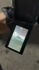 This close-up shot shows M demonstrating how to use a camera with a flip-out screen for vlogging. The viewfinder displays a nighttime cityscape, highlighting the practical application of this feature for recording in various situations. by @mo_kbs8 with Original Sound by mo_kbs8