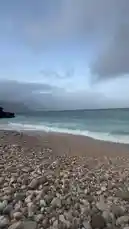 This tranquil video captures a beautiful pebble beach under a cloudy sky, with gentle waves lapping the shore. Overlaid is a powerful Arabic poem reflecting on life, destiny, and faith, creating a contemplative atmosphere perfect for relaxation or meditation. by @soldere.ledyafa with Original Sound by soldere.ledyafa