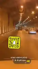Experience a first-person view of driving through a modern tunnel in Riyadh at night. The illuminated roadway guides you past other vehicles under a canopy of lights. A prominent Snapchat QR code is displayed, suggesting a connection to a digital platform or social media presence. by @s3432x with صوت قلق⏳⏳ by Contains: SILLY - Towa, kxma