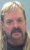 Joe Exotic has grown out hair in latest mugshot...