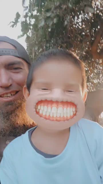Preview for a Spotlight video that uses the Grinning Face Lens