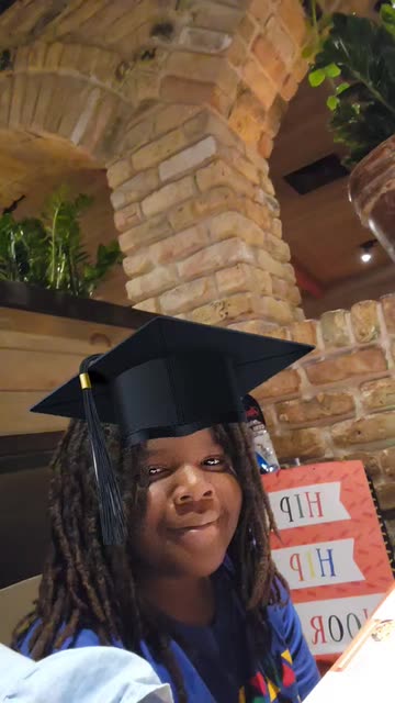Preview for a Spotlight video that uses the Happy Graduation Lens