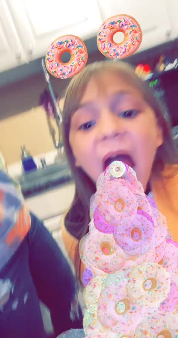 Preview for a Spotlight video that uses the Love Donuts Lens