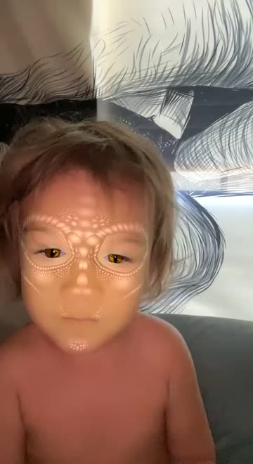 Preview for a Spotlight video that uses the Snake Face Lens