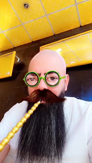 Preview for a Spotlight video that uses the Bald with glasses Lens